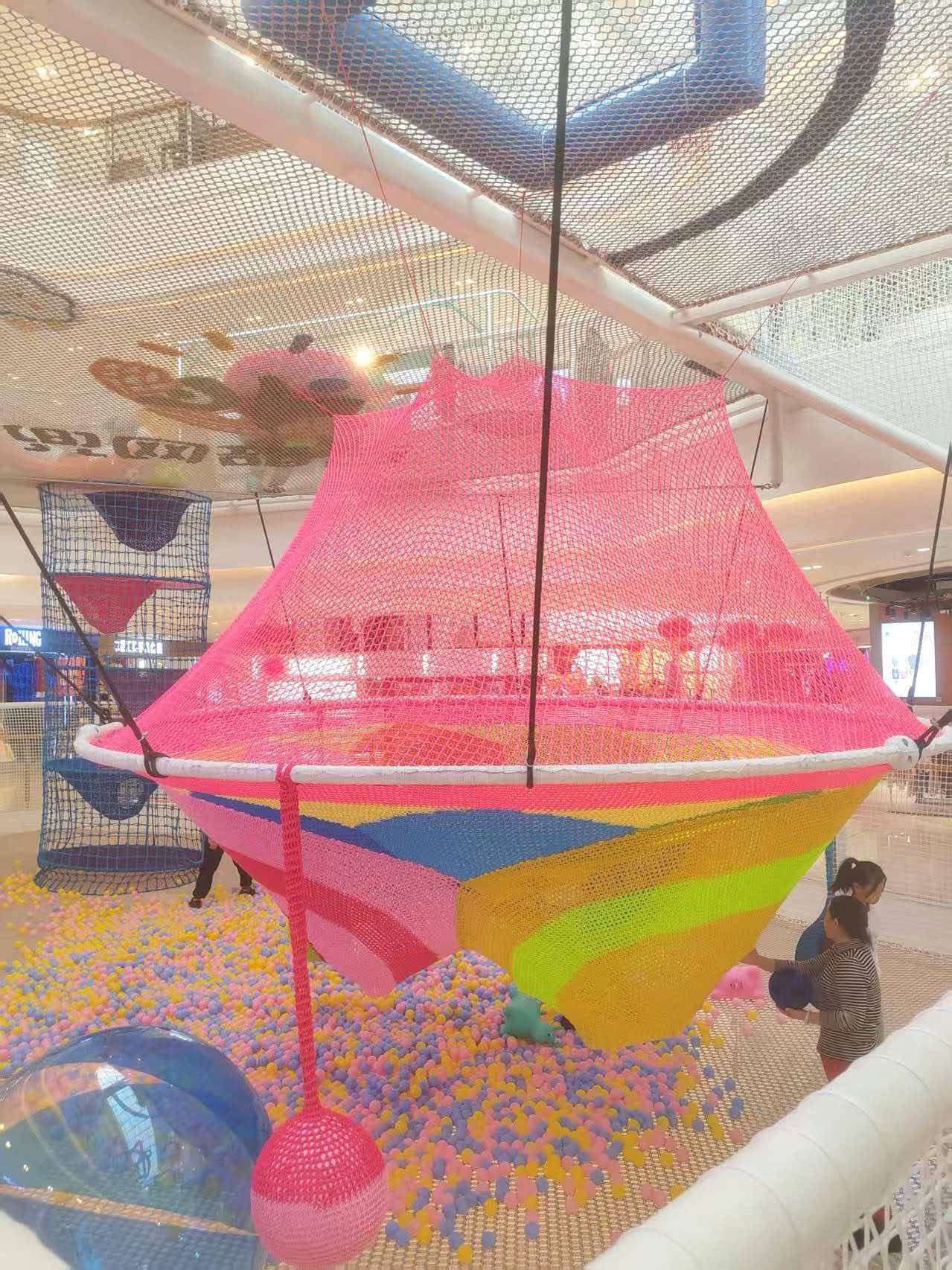 Mall atrium · net ship over a ball pool